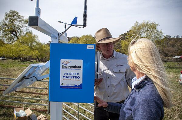 Research Coordinator Luke Peel and CEO Carolyn Hall inspect the climate station at Home Farm. (Photo taken in pre-Covid times)